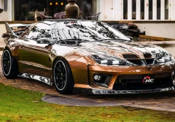 Rendu d'une Pontiac Trans Am WS6 moderne couleur bronze, vue de trois quarts avant